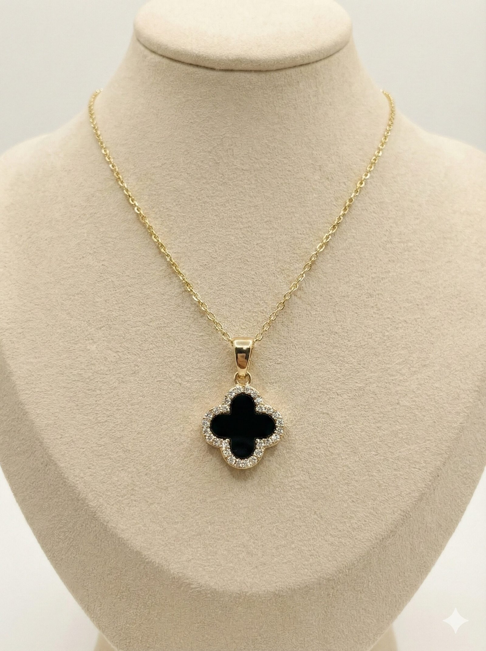 Gold-Tone Quatrefoil Pendant Necklace with Black Inlay and Crystal Halo