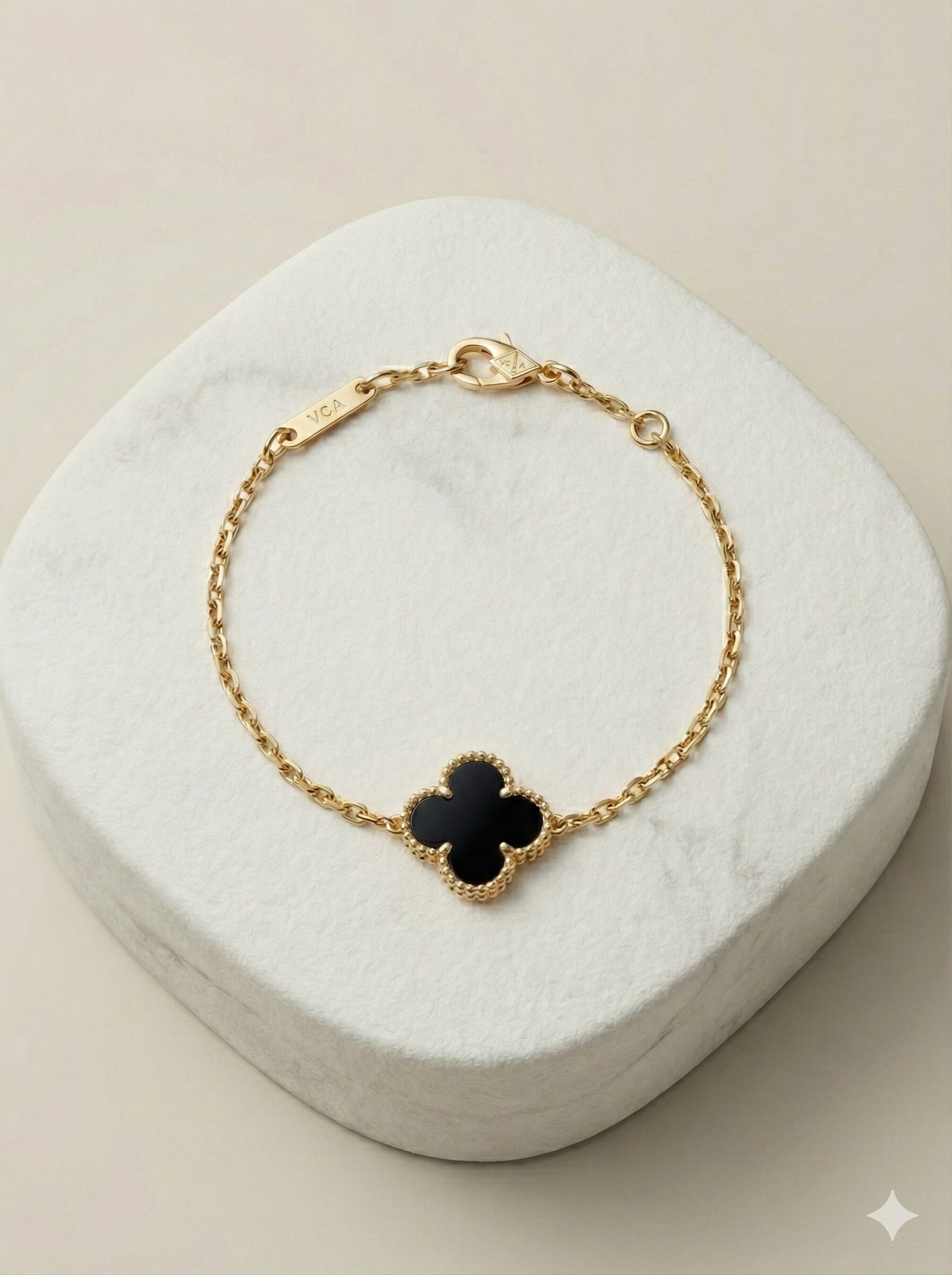 Gold-Tone Chain Bracelet with Single Black Quatrefoil Motif