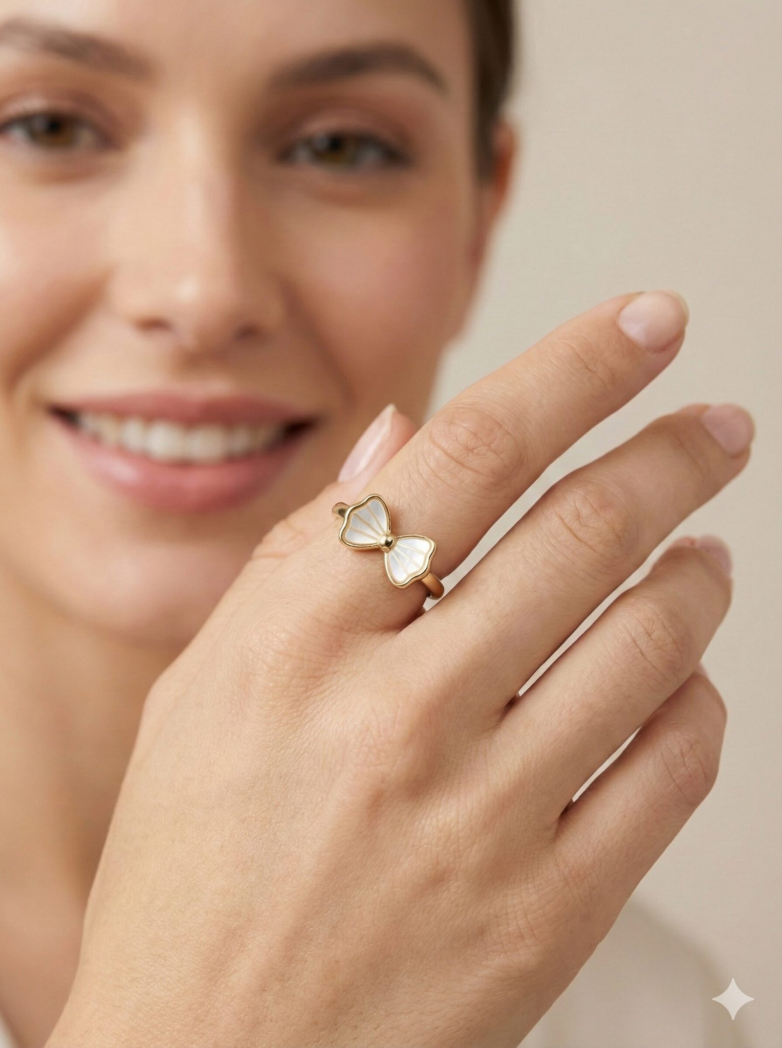 Elegant Gold-Tone Bow Ring with White Pearlescent Inlay and Radial Detailing — view 2 of 4
