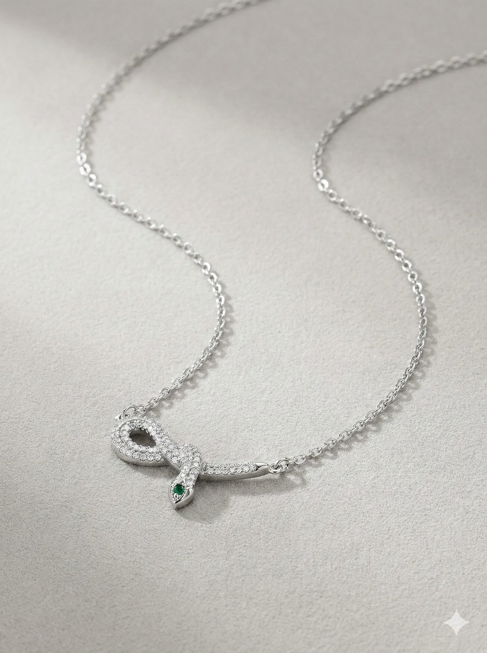 Silver-Tone Coiled Snake Pendant Necklace with Clear Pavé Stones and Green Accents