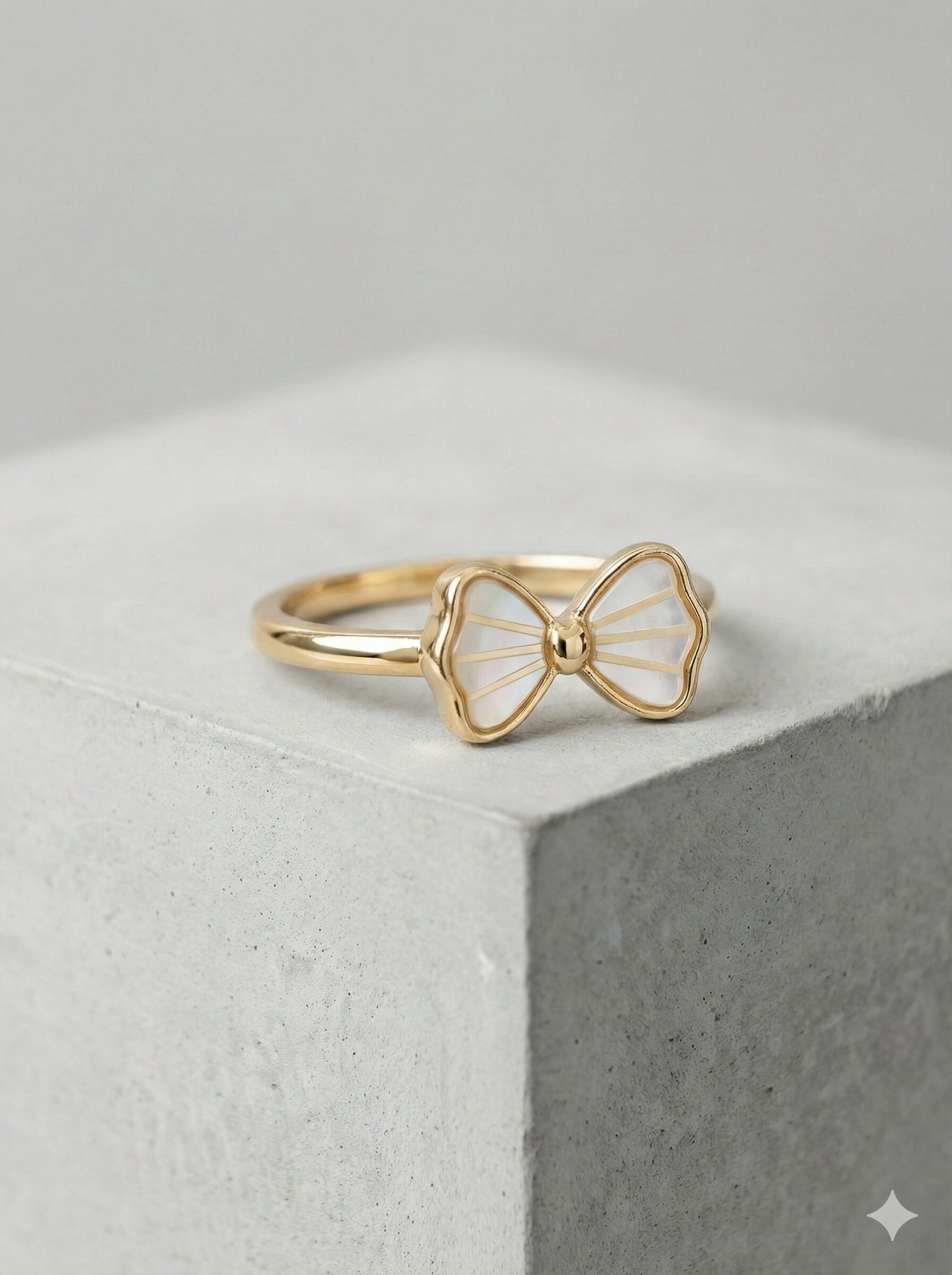 Elegant Gold-Tone Bow Ring with White Pearlescent Inlay and Radial Detailing — view 4 of 4