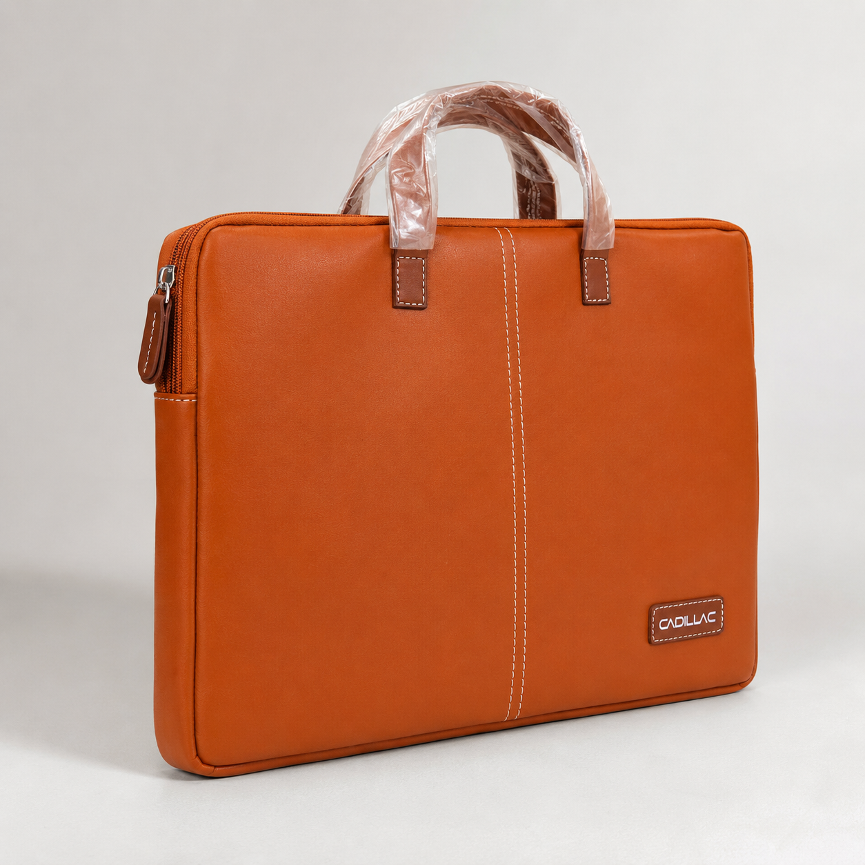 Tan laptop sleeve bag angled view showing side zip closure