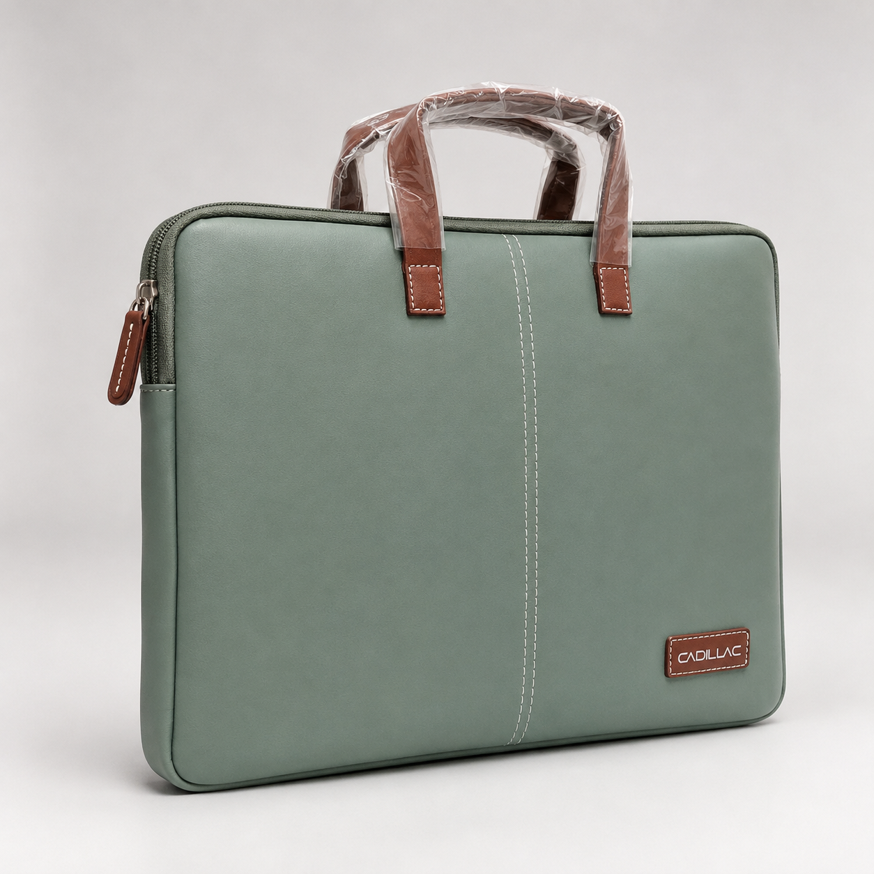 Sage green laptop sleeve bag angled view showing side zip closure