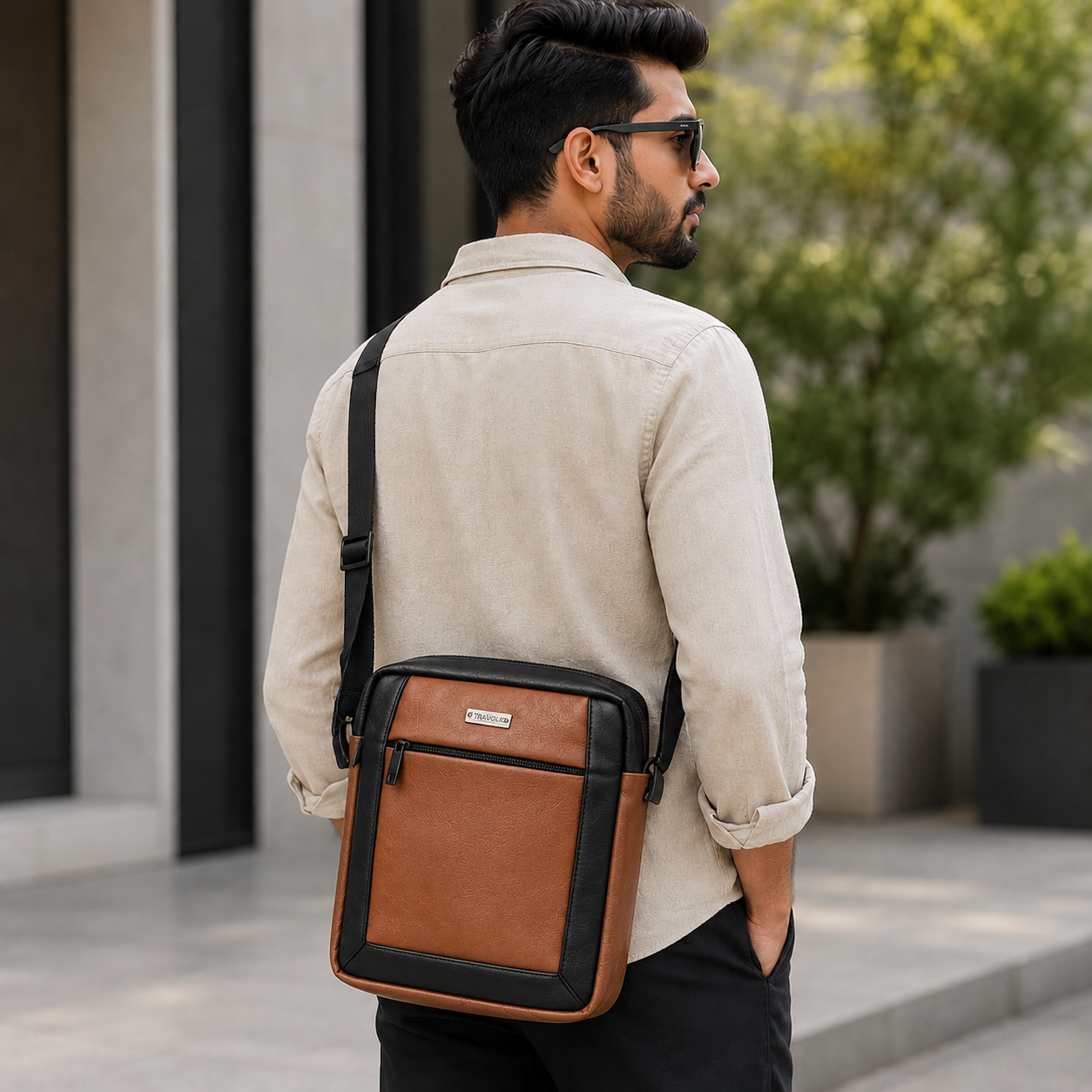 Two-tone crossbody bag detail of front zip pocket