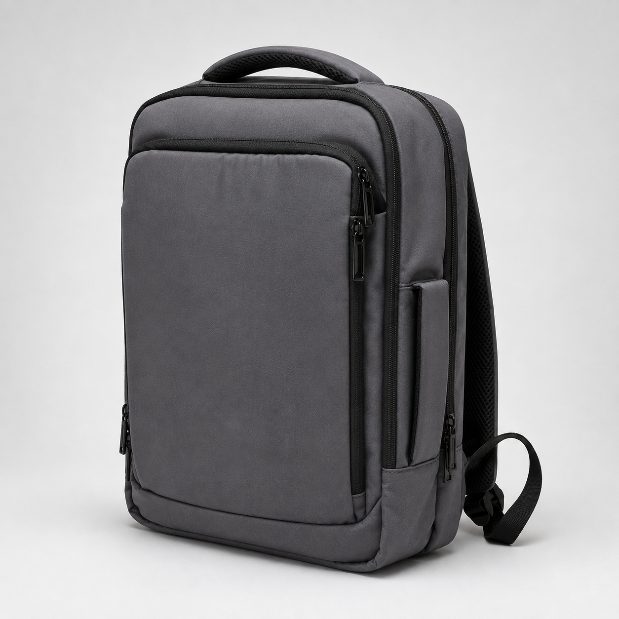 Grey travel backpack angled view showing side pocket and zips
