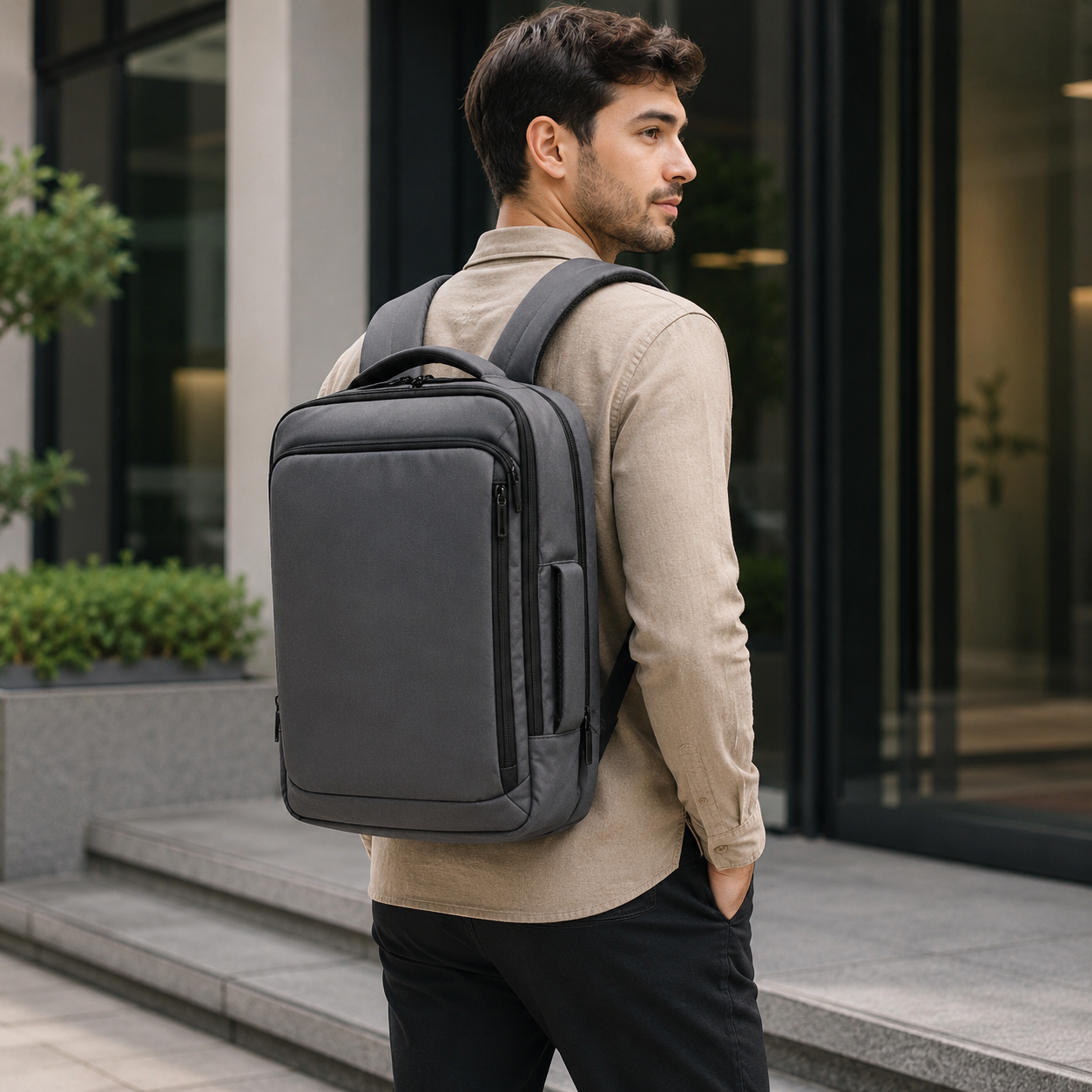 Grey backpack detail of layered front compartments