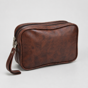 Brown faux leather dual-zip wristlet clutch front view with wrist strap